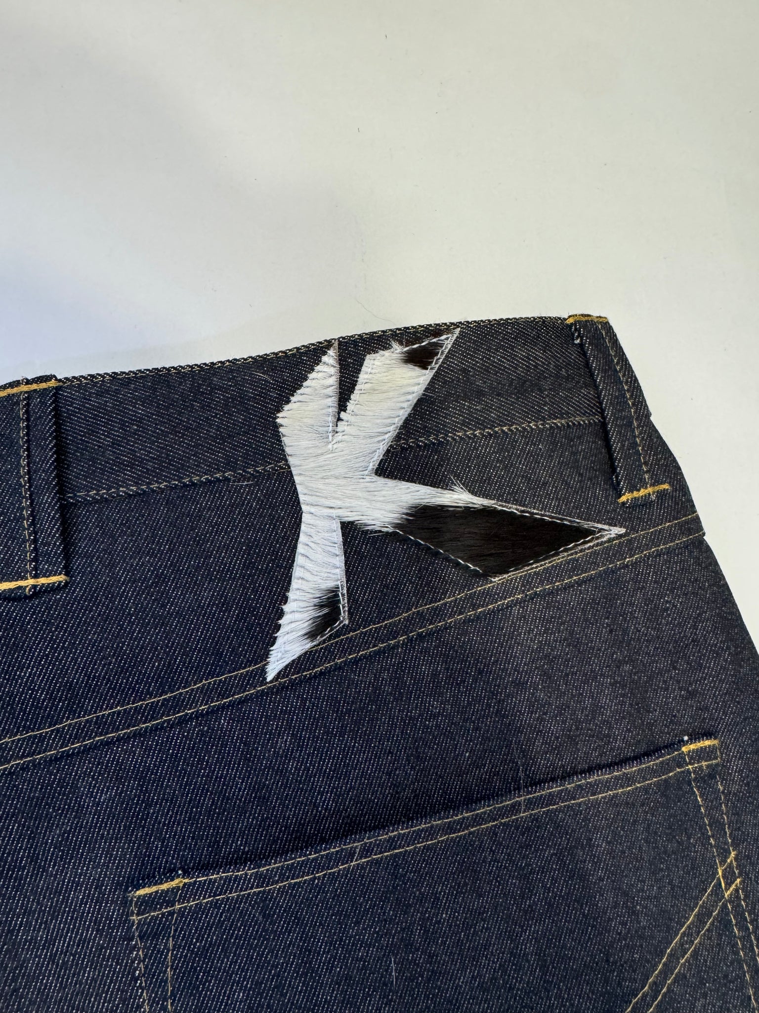 Intertwined Raw Denim Jeans